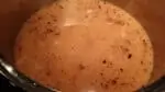 adding chicken stock for the pumpkin thyme soup