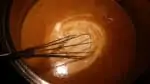 adding cream to the pumpkin thyme soup