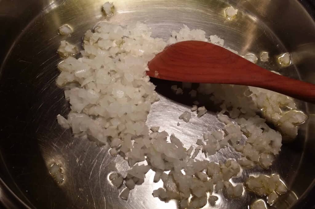 sauteing onions and garlic in large skillet for rice pilaf