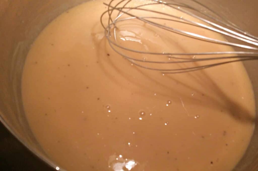 chicken stock added to butter and flour in dutch oven for asparagus soup