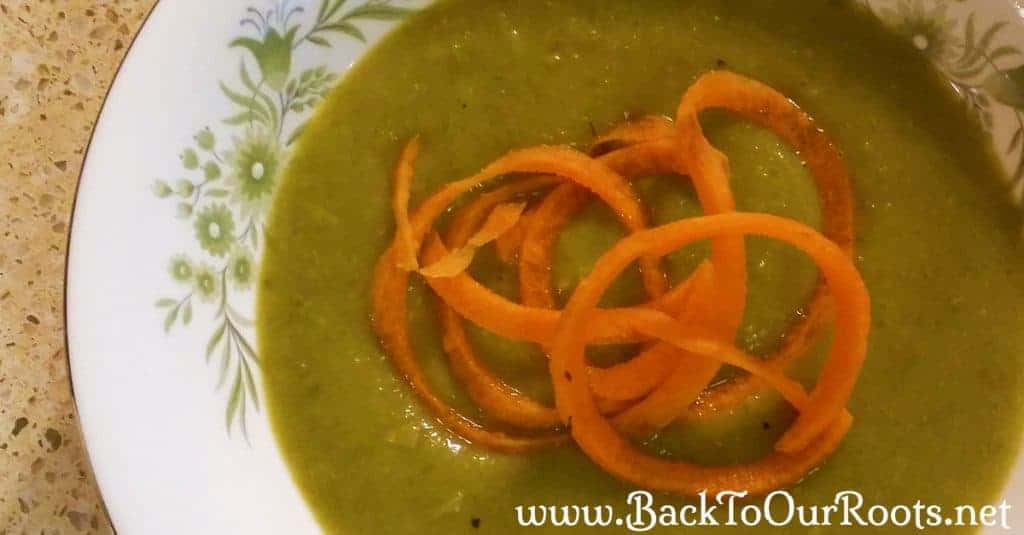 Creamy Asparagus Soup in white and green bowl
