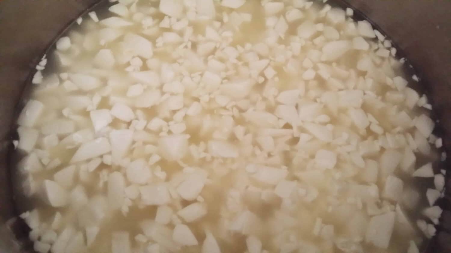 Pepper Jack Cheese curds floating in whey
