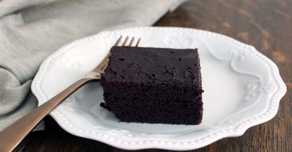chocolate cake on white plate with fork