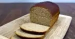 sliced Molasses Whole Wheat Bread on wooden cutting board