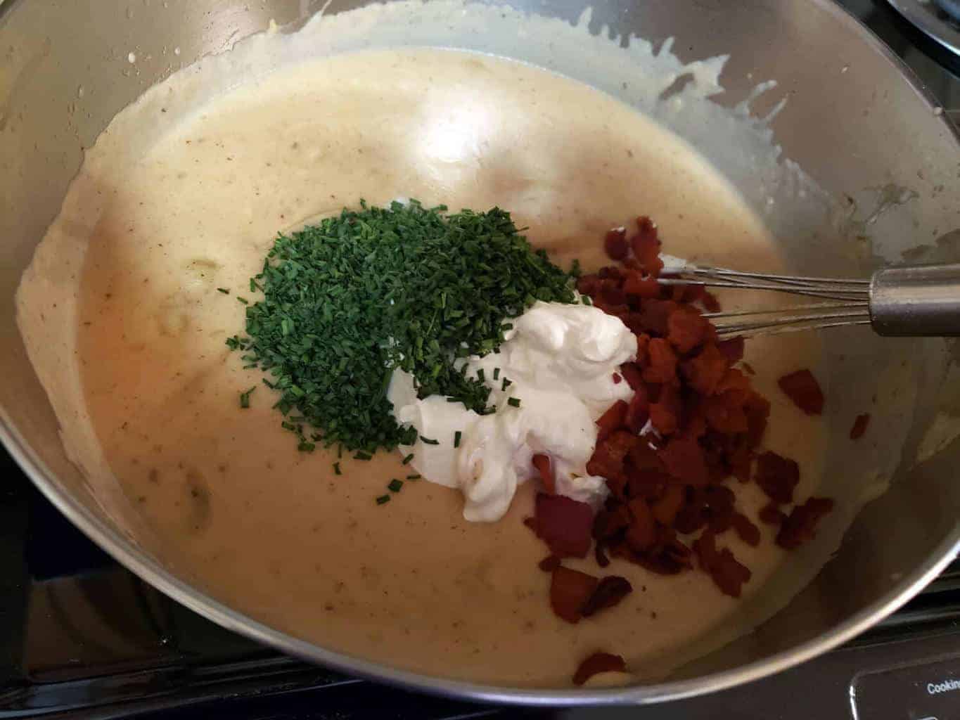 Bacon, sour cream, and chives added to Loaded Potato Soup