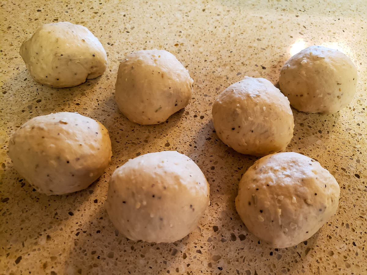 Parmesan Rosemary Breadstick dough balls on cabinet
