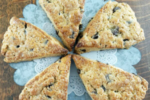 sourdough chocolate chip scones on tin plate with doily