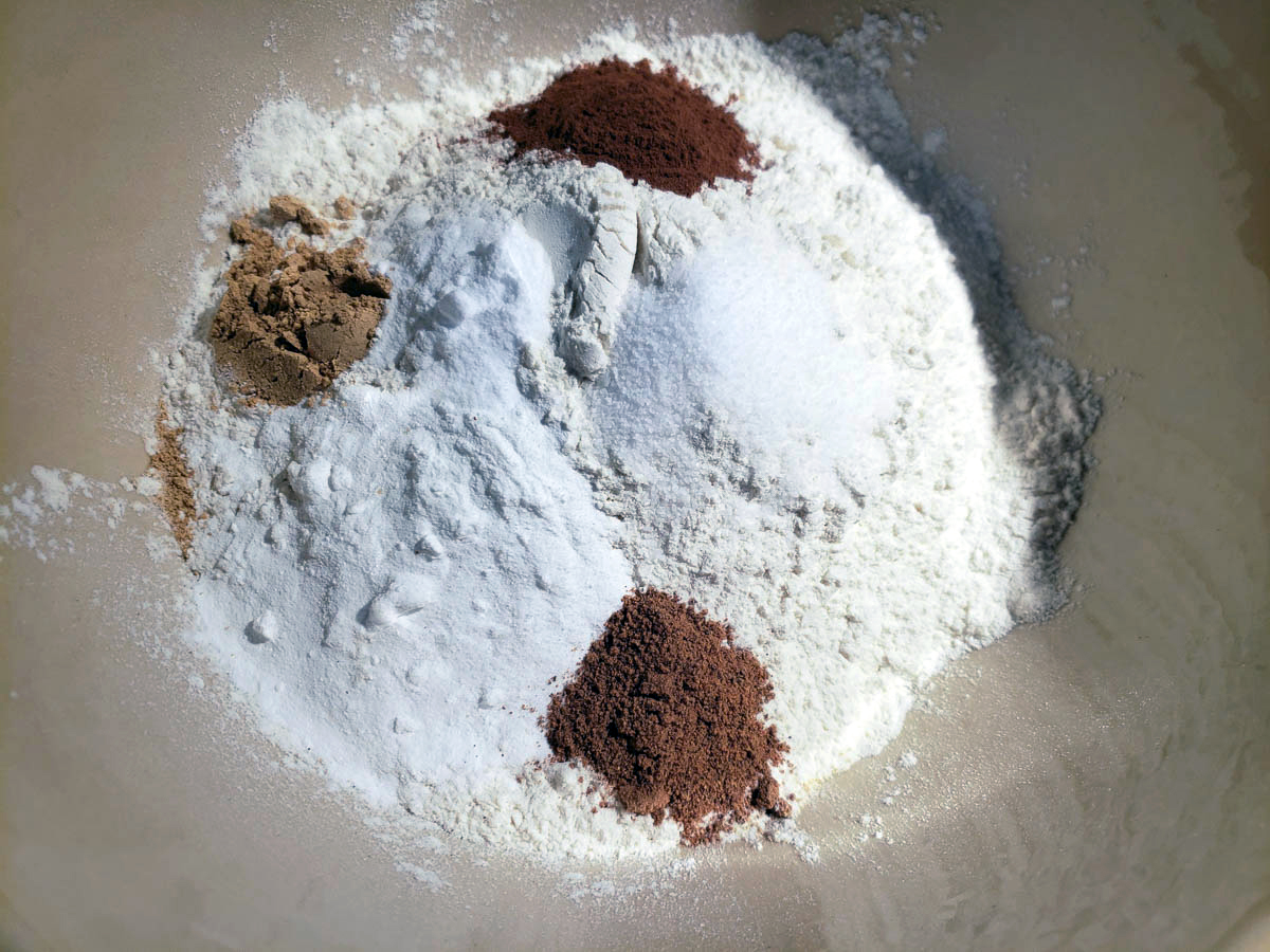 dry ingredients for sourdough pumpkin bread in white bowl