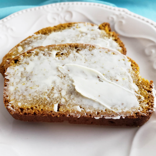 Sourdough Pumpkin Bread with butter on white plate